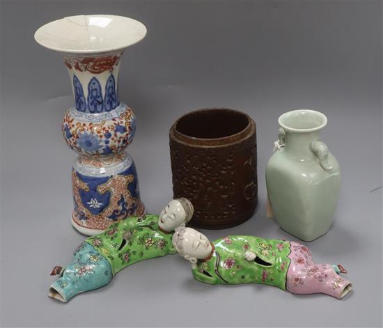 A Chinese celadon glazed vase, a carved wood brush pot, an Imari style vase, etc.